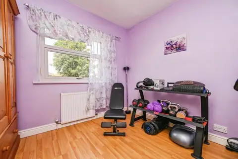 Third bedroom currently arranged as a home gym