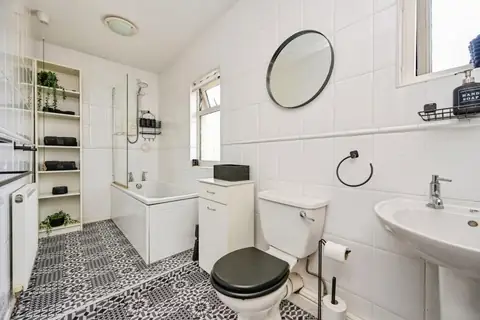 First-floor family bathroom with bath, basin and WC