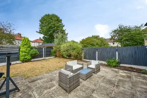 Private rear garden with paved patio and outdoor seating