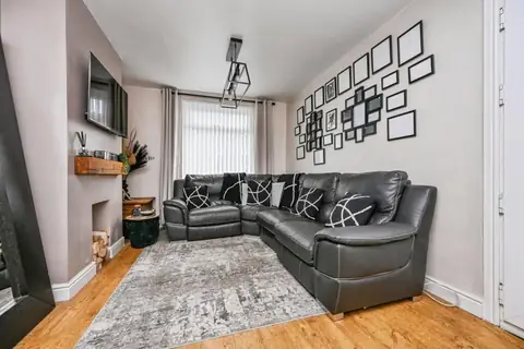 Living room with large corner sofa in the Hardinge Road family home