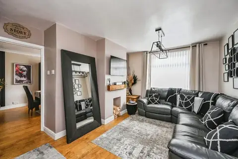 Alternative view of the living room and doorway to the dining room