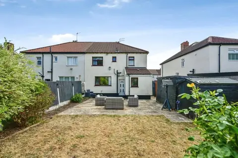 Wide view of the lawn, patio and rear exterior